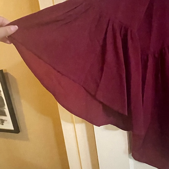 Remix Mess maroon top with bell sleeves.  Size large.  Good condition. - Picture 2 of 3